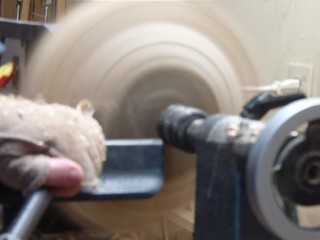 cutting the bottom of the bowl with an Oland tool